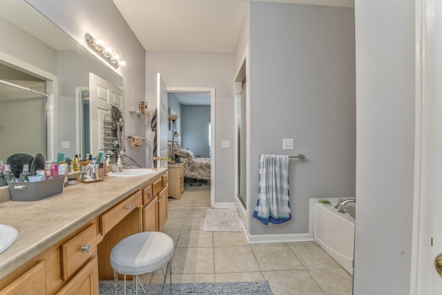 full bathroom with tile patterned floors, a shower stall, double vanity, and a sink