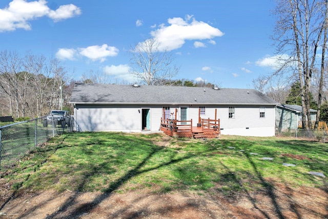 back of property featuring crawl space, a yard, a wooden deck, and a fenced backyard