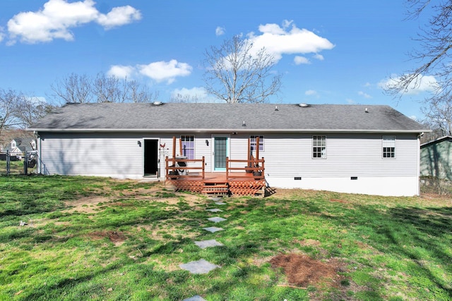 rear view of house with crawl space, a yard, a wooden deck, and a shingled roof