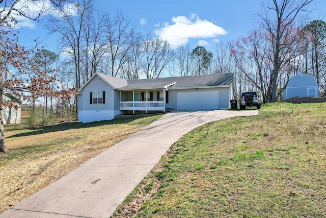 ranch-style house with a porch, an attached garage, concrete driveway, and a front yard