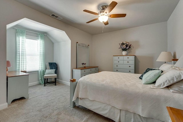 bedroom featuring ceiling fan, baseboards, visible vents, and light carpet