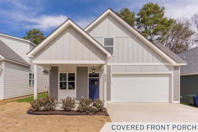 view of front facade featuring board and batten siding, a shingled roof, driveway, and a garage