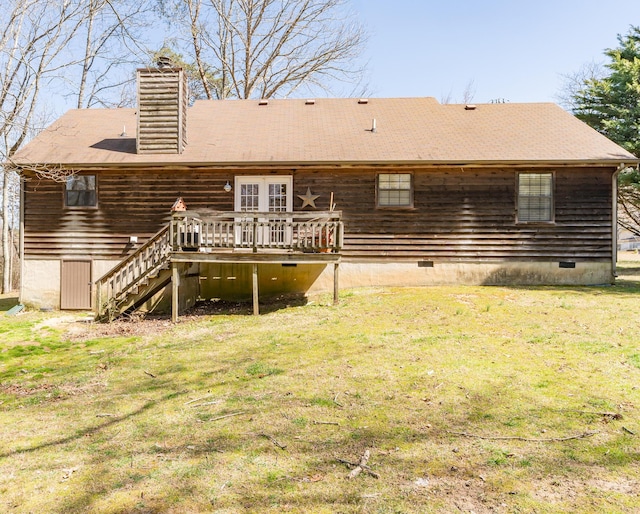 rear view of property featuring stairway, a wooden deck, a chimney, crawl space, and a lawn