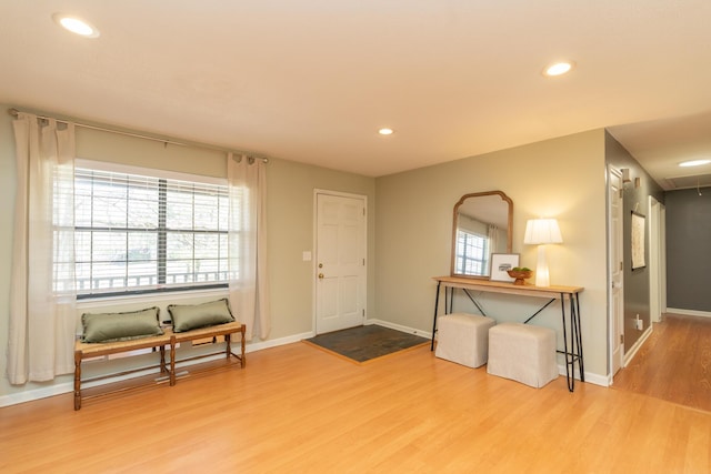 entrance foyer with recessed lighting, baseboards, and wood finished floors