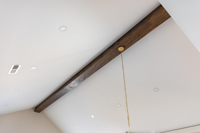 room details featuring beam ceiling, visible vents, and recessed lighting