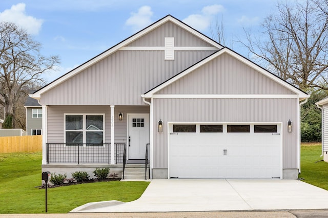 view of front facade with a garage, a porch, concrete driveway, and a front lawn