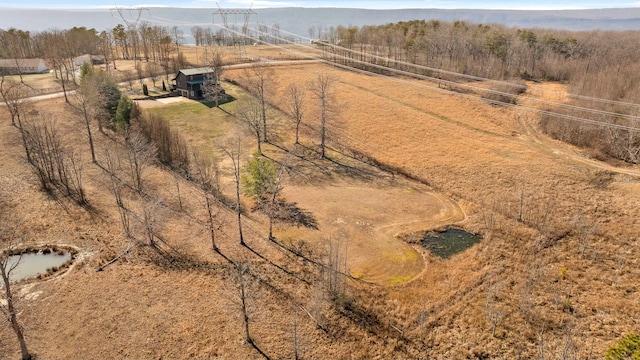 birds eye view of property with a rural view