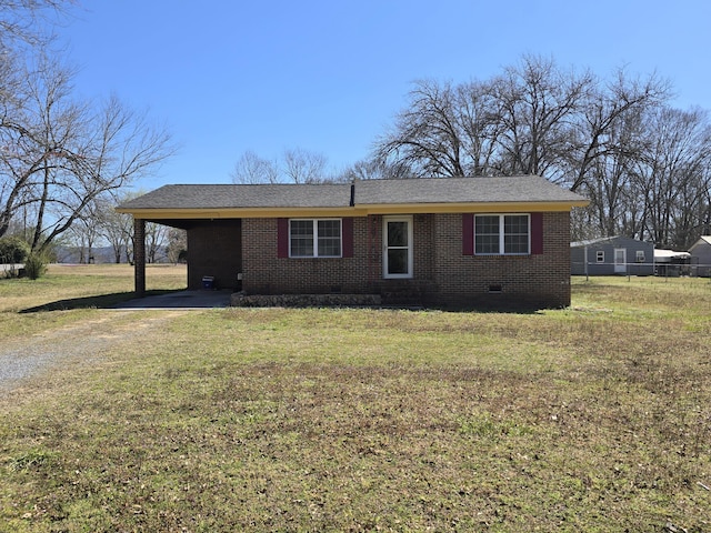 view of front of home with an attached carport, a front yard, driveway, crawl space, and brick siding