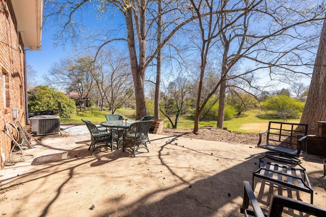 view of patio featuring central AC unit and outdoor dining space