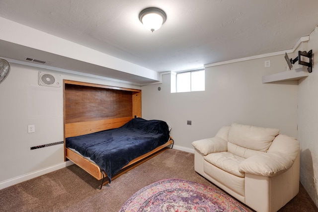 carpeted bedroom featuring visible vents and baseboards
