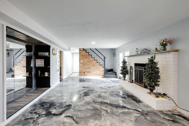 below grade area with stairway and a fireplace