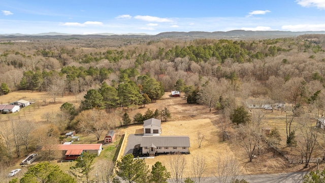 bird's eye view with a wooded view and a mountain view