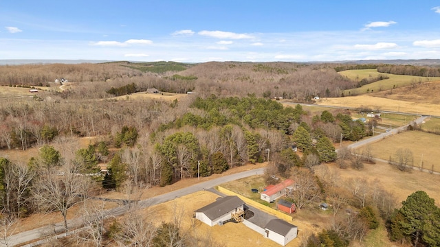 birds eye view of property with a rural view