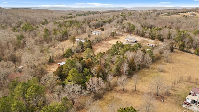 aerial view featuring a view of trees