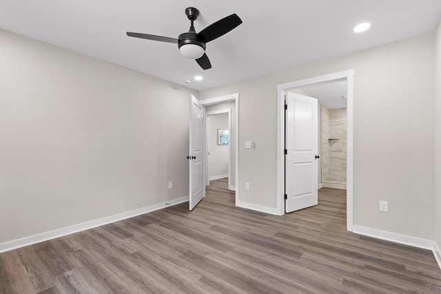 unfurnished bedroom featuring recessed lighting, baseboards, wood finished floors, and ceiling fan