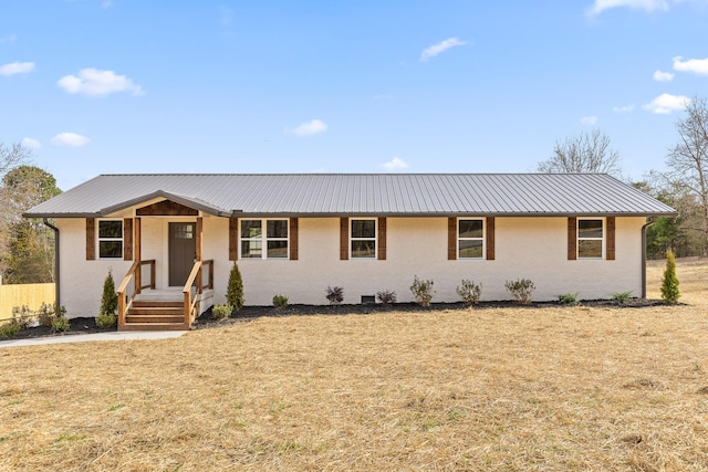 single story home with metal roof