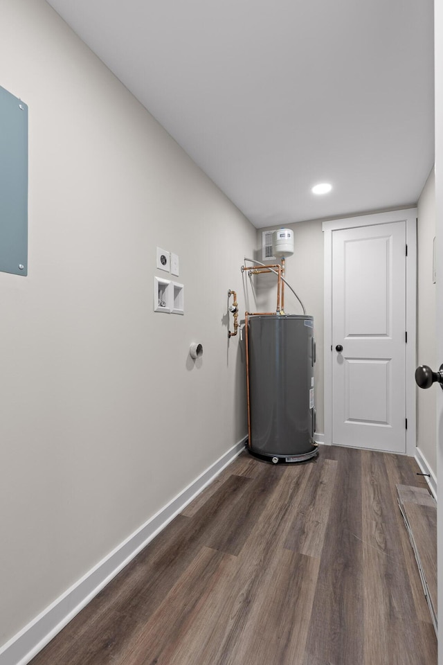 laundry area featuring baseboards, hookup for an electric dryer, laundry area, water heater, and dark wood-type flooring