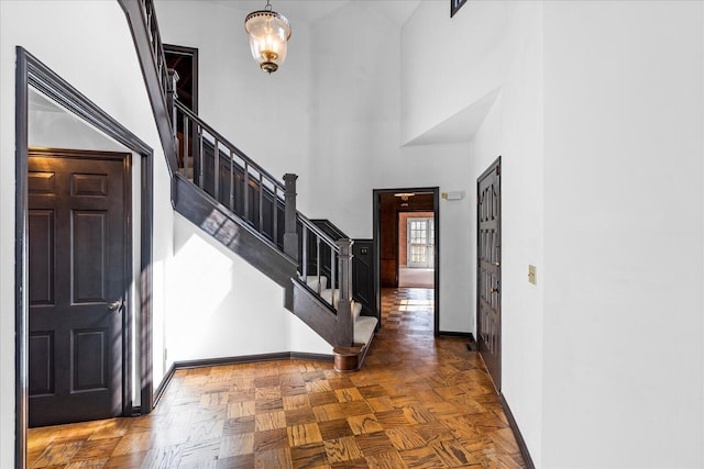 5803 Lake Resort Dr, Hixson, TN 37343 - foyer featuring stairway, baseboards, and a high ceiling