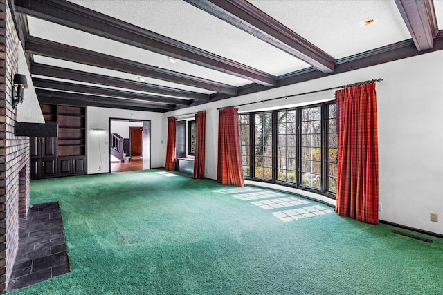 5803 Lake Resort Dr, Hixson, TN 37343 - unfurnished living room featuring visible vents, beam ceiling, a textured ceiling, and carpet flooring