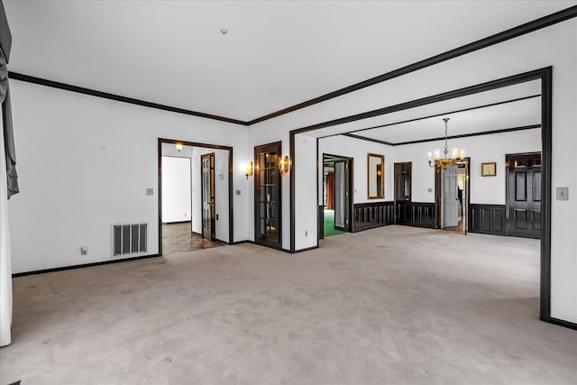 5803 Lake Resort Dr, Hixson, TN 37343 - interior space featuring visible vents, carpet floors, wainscoting, crown molding, and a chandelier