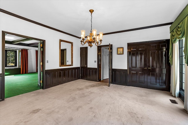 5803 Lake Resort Dr, Hixson, TN 37343 - interior space with visible vents, a wainscoted wall, beam ceiling, ornamental molding, and a chandelier
