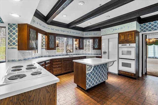 5803 Lake Resort Dr, Hixson, TN 37343 - kitchen featuring brick patterned floor, white appliances, light countertops, and a sink