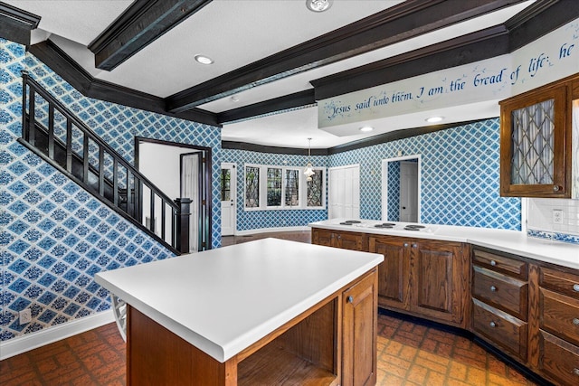 5803 Lake Resort Dr, Hixson, TN 37343 - kitchen featuring baseboards, light countertops, a center island, and wallpapered walls