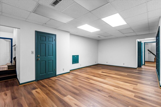 5803 Lake Resort Dr, Hixson, TN 37343 - empty room with a drop ceiling, visible vents, baseboards, and light wood-style flooring