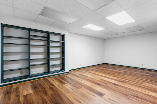 5803 Lake Resort Dr, Hixson, TN 37343 - unfurnished room with a drop ceiling, baseboards, and wood finished floors