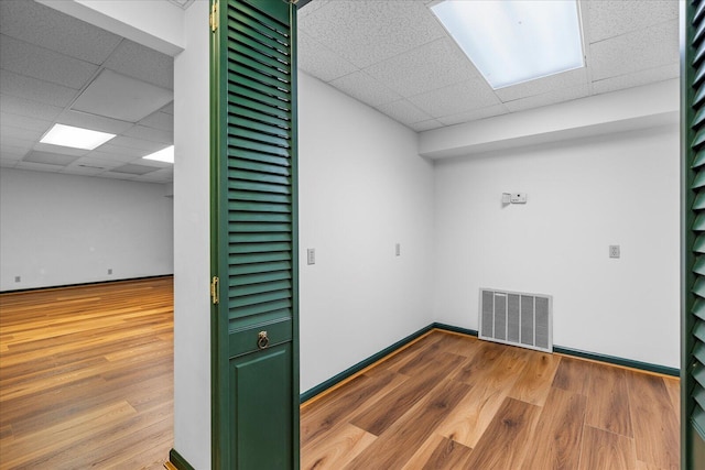 5803 Lake Resort Dr, Hixson, TN 37343 - spare room with visible vents, a paneled ceiling, baseboards, and wood finished floors