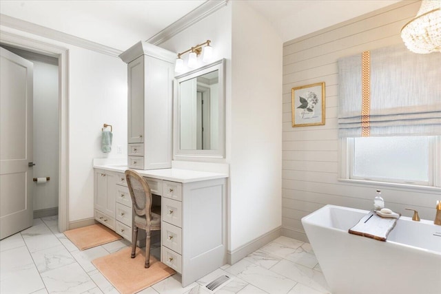 bathroom with baseboards, a freestanding bath, marble finish floor, and wood walls