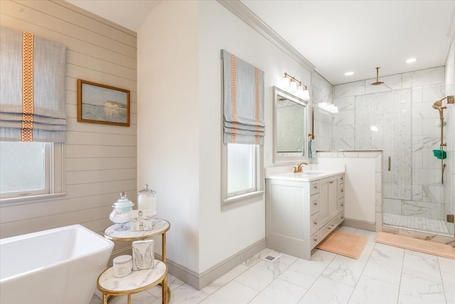 bathroom with marble finish floor, wooden walls, a shower stall, baseboards, and vanity