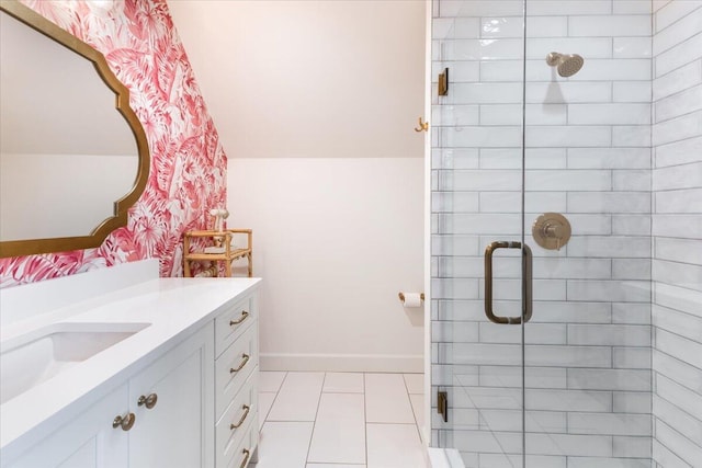 full bathroom featuring tile patterned floors, a shower stall, vanity, and baseboards