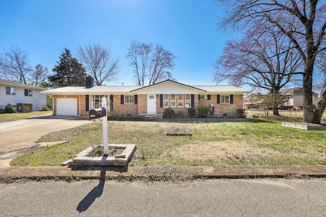 ranch-style house featuring crawl space, a garage, driveway, and brick siding