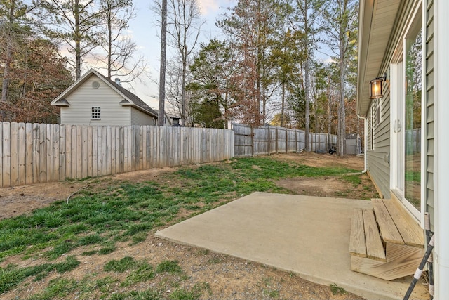 view of yard featuring a patio and a fenced backyard