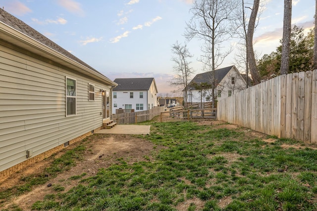 view of yard featuring a patio area and a fenced backyard