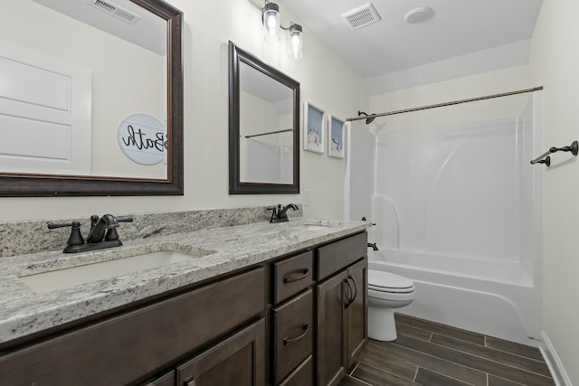 full bathroom with wood finish floors, visible vents, and a sink