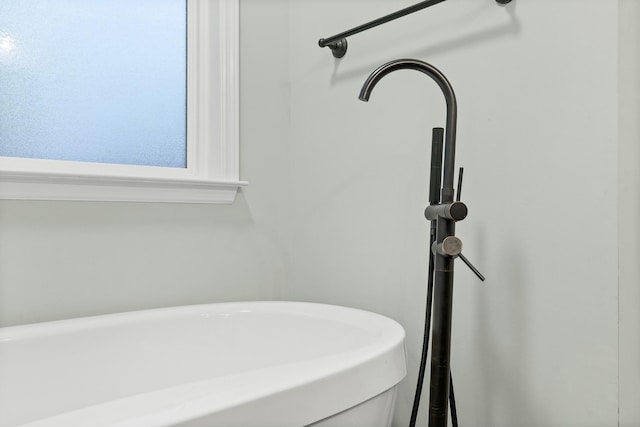 full bathroom featuring a soaking tub