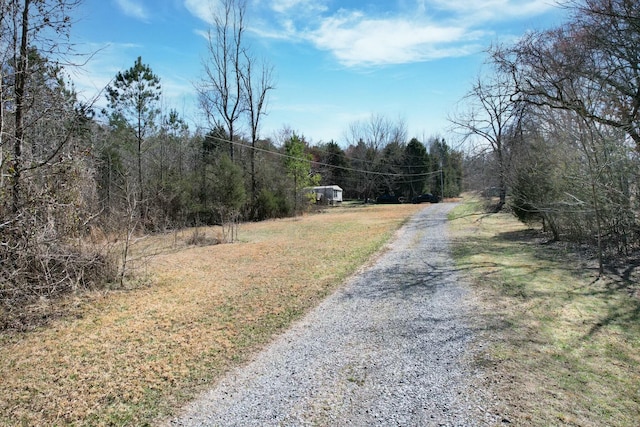 view of street featuring a wooded view