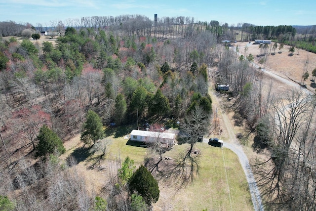 bird's eye view featuring a forest view and a rural view