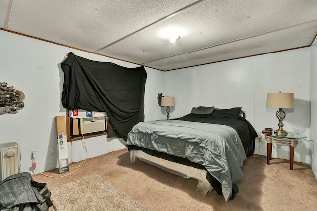 bedroom with radiator heating unit, cooling unit, carpet floors, and a textured ceiling