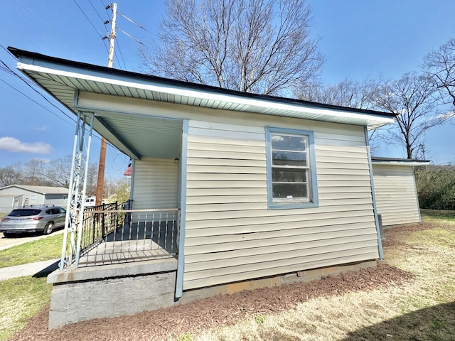 view of home's exterior featuring an outbuilding