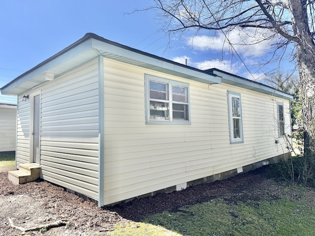 view of property exterior with entry steps