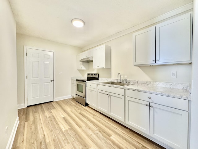 kitchen featuring light wood finished floors, electric range, a sink, white cabinets, and under cabinet range hood