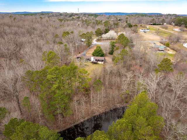 birds eye view of property with a wooded view