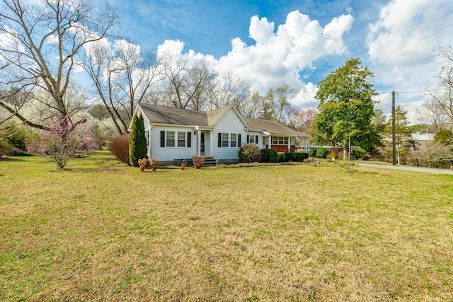 single story home featuring a front lawn