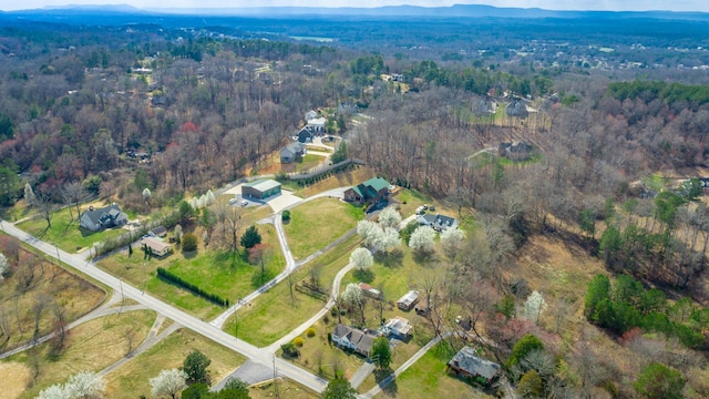 aerial view featuring a view of trees