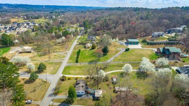 aerial view featuring a wooded view