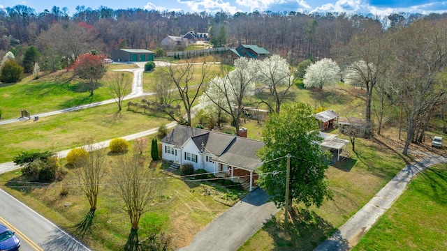 aerial view featuring a wooded view