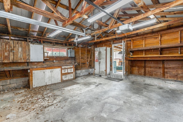 garage featuring a workshop area and a garage door opener